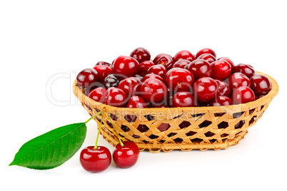 Ripe cherries in basket isolated on white