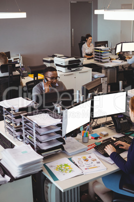 Coworkers working at their desk in office