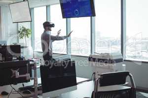 Side view of businessman using virtual reality technology