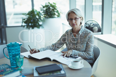 Portrait of businesswoman working