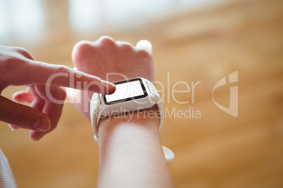 Cropped image of female basketball player using smartwatch