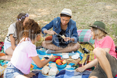 Happy friends preparing smores