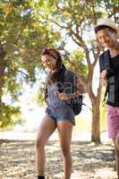 Smiling friends with backpack