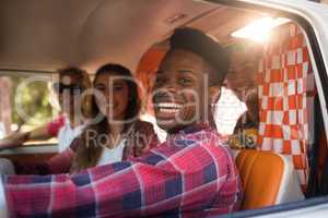 Cheerful friends in camper van