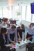 Business colleagues working at office desk