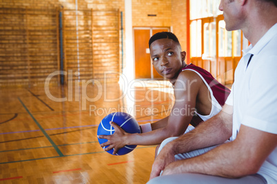 Basketball player looking at coach