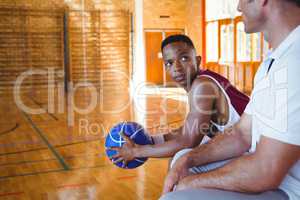 Basketball player looking at coach