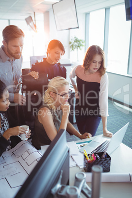 Colleagues working together at office