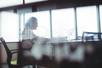 Businesswoman sitting at office cafeteria