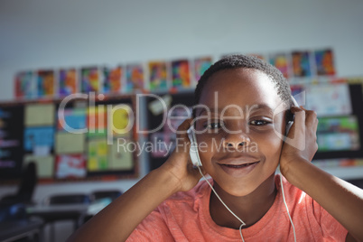 Close up portrait of boy listening music