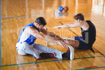 High angle view of male friends exercising in court