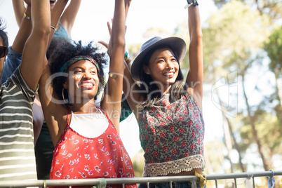 Happy females enjoying at music festival