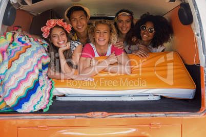 Portrait of smiling friends in camper van