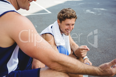 Happy friends at basketball court