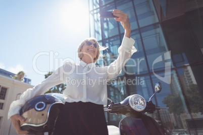 Businesswoman taking selfie