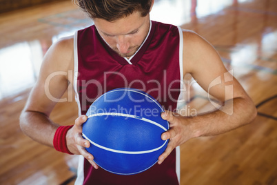 High angle view of male basketball player holding ball