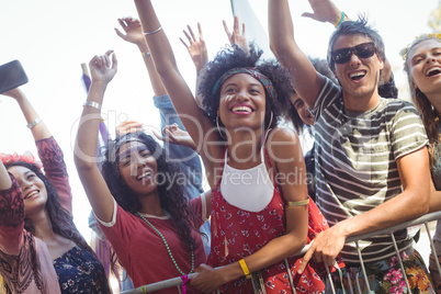 Cheerful friends enjoying music festival