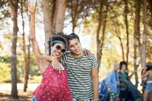 Portrait of happy young friends standing together