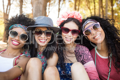 Portrait of smiling female friends at campsite