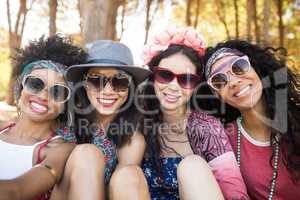 Portrait of smiling female friends at campsite