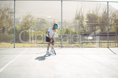 Girl playing at tennis court