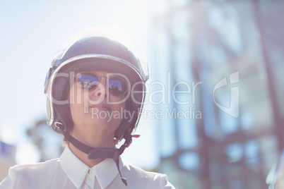 Low angle view of businesswoman wearing helmet