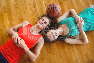Overhead portrait of friends in basketball court