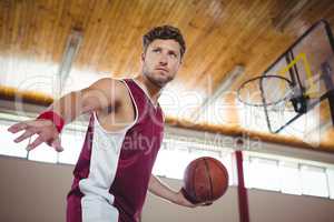 Close up of man practicing basketball