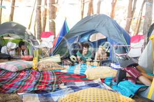 Couple relaxing in tent
