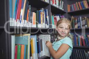 Girl choosing book from shelf
