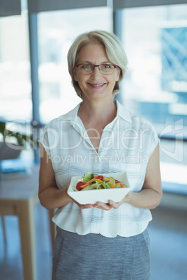 Businesswoman holding food