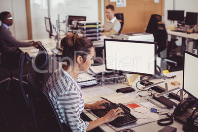 High angle view of businesswoman working on computer at desk