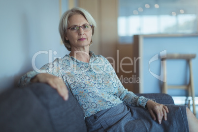 Businesswoman sitting on sofa