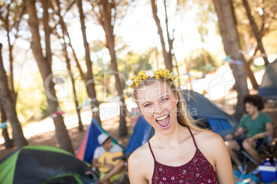 Portrait of cheerful woman at campsite