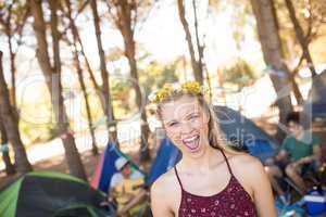 Portrait of cheerful woman at campsite