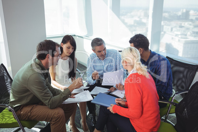 Business people discussing together at office