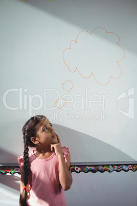 Thoughtful girl looking at speech bubble