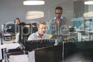 Focused business colleagues working at desk