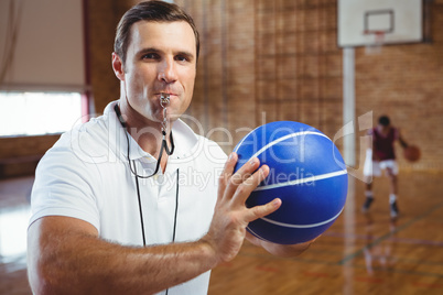 Portrait of coach whistling