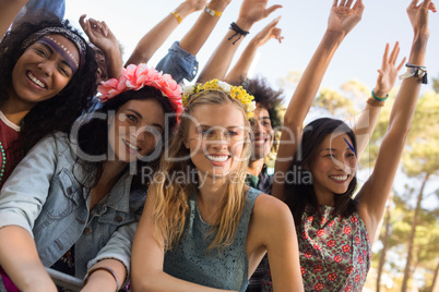 Happy female friends at music festival