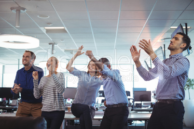 Cheerful business colleagues looking away