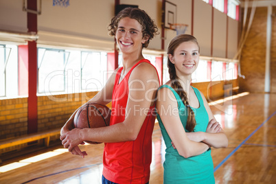 Portrait of basketball players standing back to back