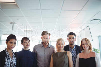 Portrait of young business people standing together