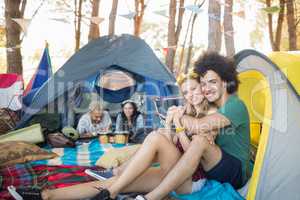 Portrait of smiling couple in tent