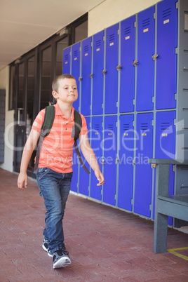 Full length of cute boy walking in corridor