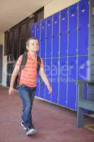Full length of cute boy walking in corridor