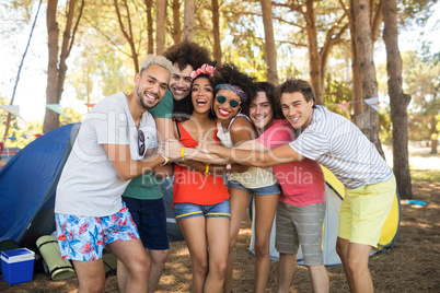 Portrait of cheerful friends embracing