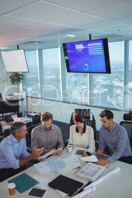 Business partners discussing in meeting at office desk