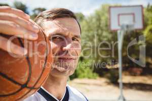 Close up of confident basketball player with ball
