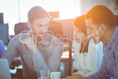 Focused business partners discussing in meeting